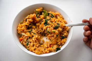 Risotto with tomatoes, fresh herbs and parmesan cheese