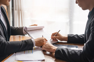 asian businessmen having a meeting discussing partnership signing contract of agreement on...