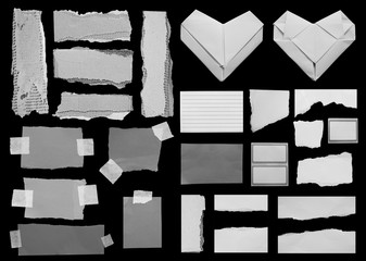 Set of torn paper texture on black background, copy space.