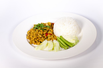 Thai food stir fried pork with yellow spicy curry white dish isolated