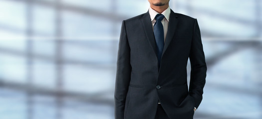 Fototapeta premium Business portrait of handsome man in black suit