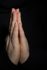 Hands folded in prayer