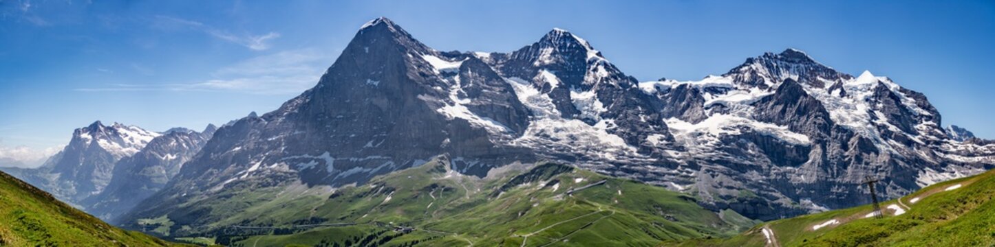 Switzerland, Panoramic view on Eiger, Monch and Jungfraujoch and green Alps around Mannlichen