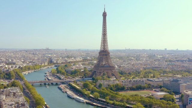 PARIS, FRANCE - MAY, 2019: Aerial drone view of Eiffel tower and Seine river in historical city centre from above.