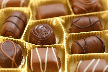 chocolate candy  close-up.assorted chocolate sweets.Chocolate candies set in an open box. .sweet dessert closeup.gift box.Details sweets praline chocolate sweets.