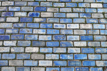 A pattern of weathers blue bricks from the street of San Juan Puerto Rico