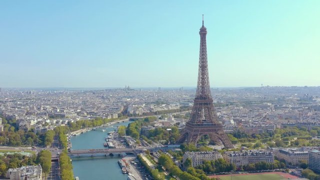 PARIS, FRANCE - MAY, 2019: Aerial drone view of Eiffel tower and Seine river in historical city centre from above.