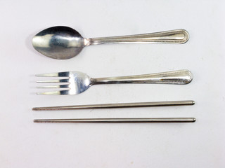 Spoons, fork, chopsticks White background