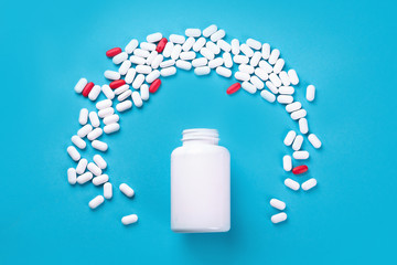 Heap of pills on blue background