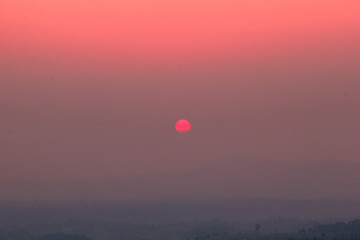 The blurred abstract background of the sun reversing the horizon in the mountains, colorful change over time, the beauty of seasonal nature