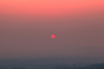 The blurred abstract background of the sun reversing the horizon in the mountains, colorful change over time, the beauty of seasonal nature