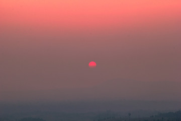 The blurred abstract background of the sun reversing the horizon in the mountains, colorful change over time, the beauty of seasonal nature