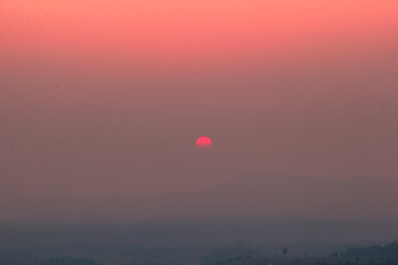 The blurred abstract background of the sun reversing the horizon in the mountains, colorful change over time, the beauty of seasonal nature