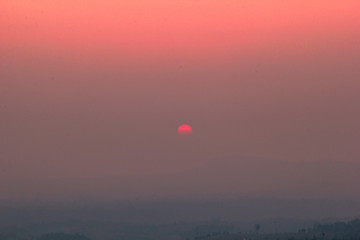 The blurred abstract background of the sun reversing the horizon in the mountains, colorful change over time, the beauty of seasonal nature