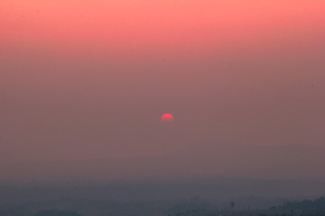 The blurred abstract background of the sun reversing the horizon in the mountains, colorful change over time, the beauty of seasonal nature