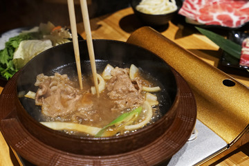 Close up Sliced Wagyu beef in Sukiyaki pot ,Japanese hot pot
