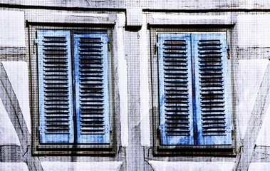 Close up of blue shutters on old timbered house