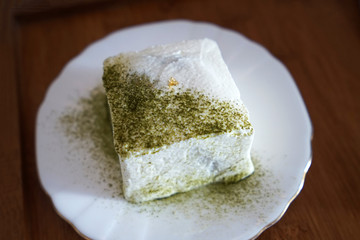Close up Matcha green tea and white chocolate cake