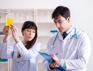 Two doctors discussing plasma and blood transfusion
