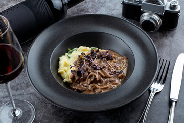 Veal beef stroganoff with oyster mushrooms and creamy mashed potato – comfort food in a restaurant