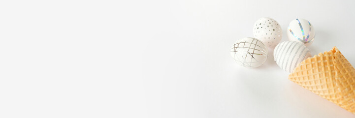 White easter eggs with silver pattern on white