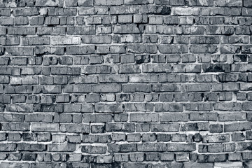 Part of the brick wall of the building. Toned in black and white. Background concept