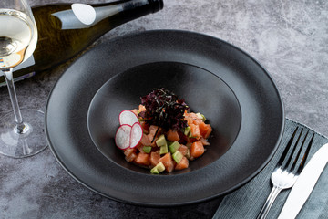 Salmon tartare with avocado and special chef's sauce with white wine and soy sauce