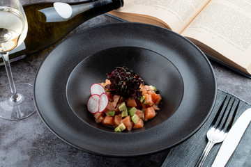 Salmon tartare with avocado and special chef's sauce with white wine and soy sauce