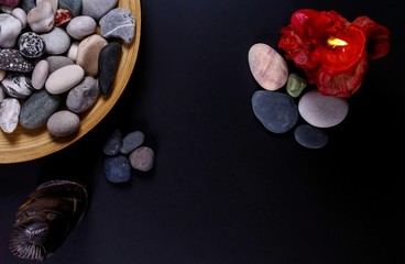 Young fortune teller divines the hand of young man around candles and other magical paraphernalia. Divine magic and occultism concept. Divination. Top view, toned.