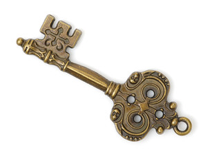 old brass key against a white background