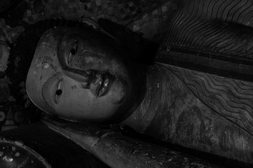 Cave temple in Dambulla. statues inside the temple. Black and white images