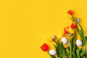Springtime season greeting card - happy easter concept - multicolored tulips and eggs on bright yellow background, copy space, sale, discount, celebrate banner