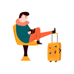 Young man waiting in the airport for the flight.