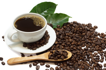 Coffee mugs, coffee leaves and roasted coffee beans isolated on a white background