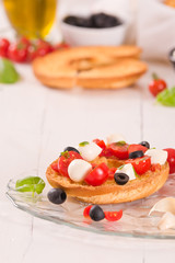 Friselle with tomatoes and mozzarella cheese.