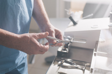 medical instruments in the hands of a doctor. Close-up.