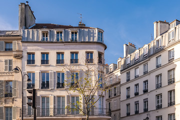 Naklejka premium Paris, typical facade and windows, beautiful building in Montmartre, with old zinc roofs