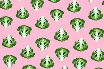 Seamless minimalistic pattern with broccoli on a pink background. Photo collage, vegan pop art...