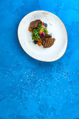 healthy meat for a dinner on a blue background