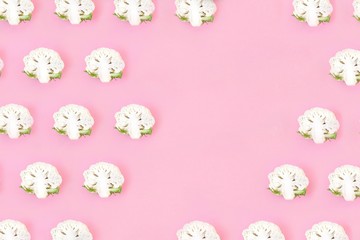 Cauliflower seamless pattern on a pink pastel background. Vegetables abstract background, pop art design. Healthy eating concept. Top view, flat lay with copy space for text.