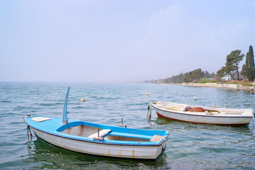 Naklejka na ściany i meble Beautiful landscape with seashore and fishing boat.