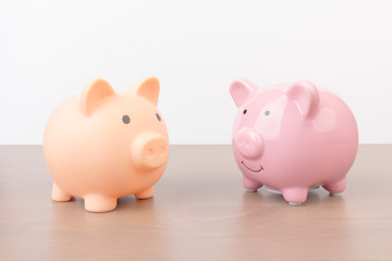 Piggy bank  on wooden background, space for text. Finance, saving money