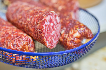 Raw smoked sausages on a shop counter.