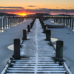 Long pier in snow, Gothenburg, Sweden