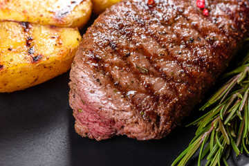 Ribeye steak with potatoes, onions and cherry tomatoes