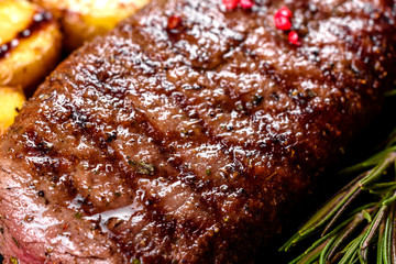 Ribeye steak with potatoes, onions and cherry tomatoes