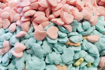 The background of the small candy Souffle pastel colors. Soft sweet Marshmallows scattered, top view.