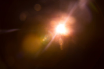 Abstract Natural Sun flare on the black background.