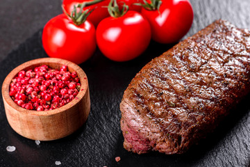 Ribeye steak with potatoes, onions and cherry tomatoes