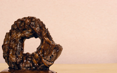 chocolate muffin donut with chocolate drops appearing to melt